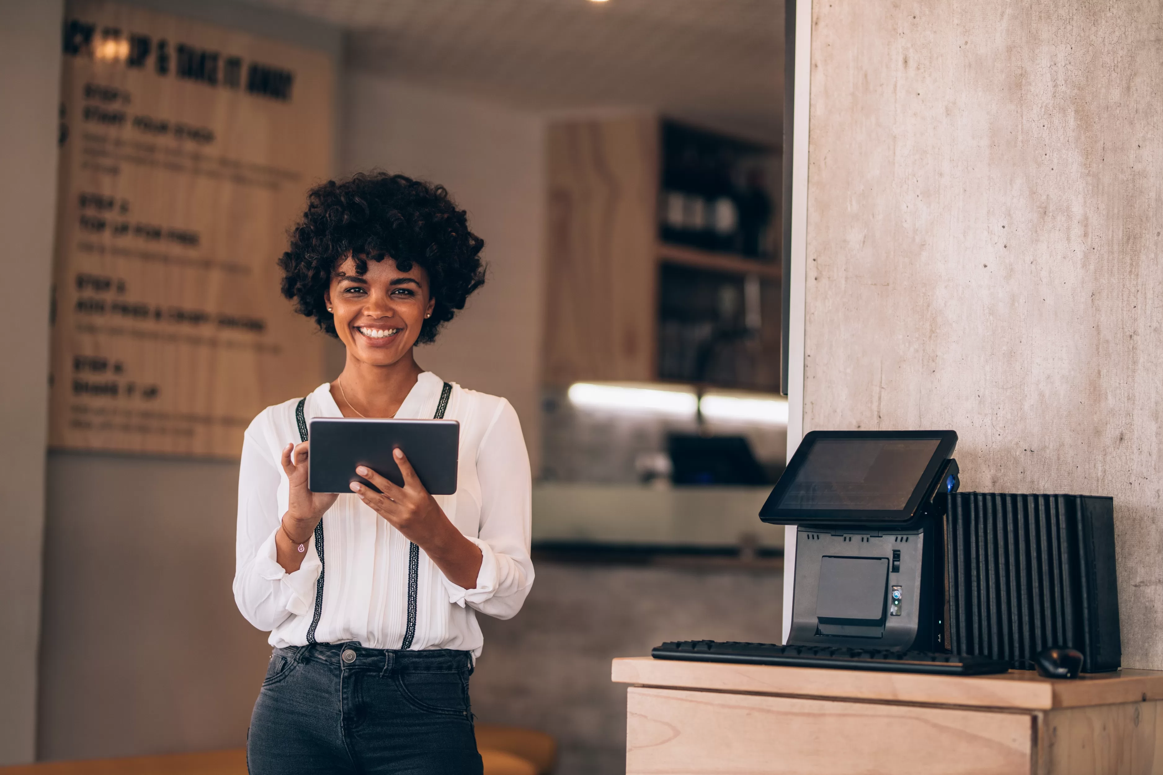 Woman using a tablet at a restaurant